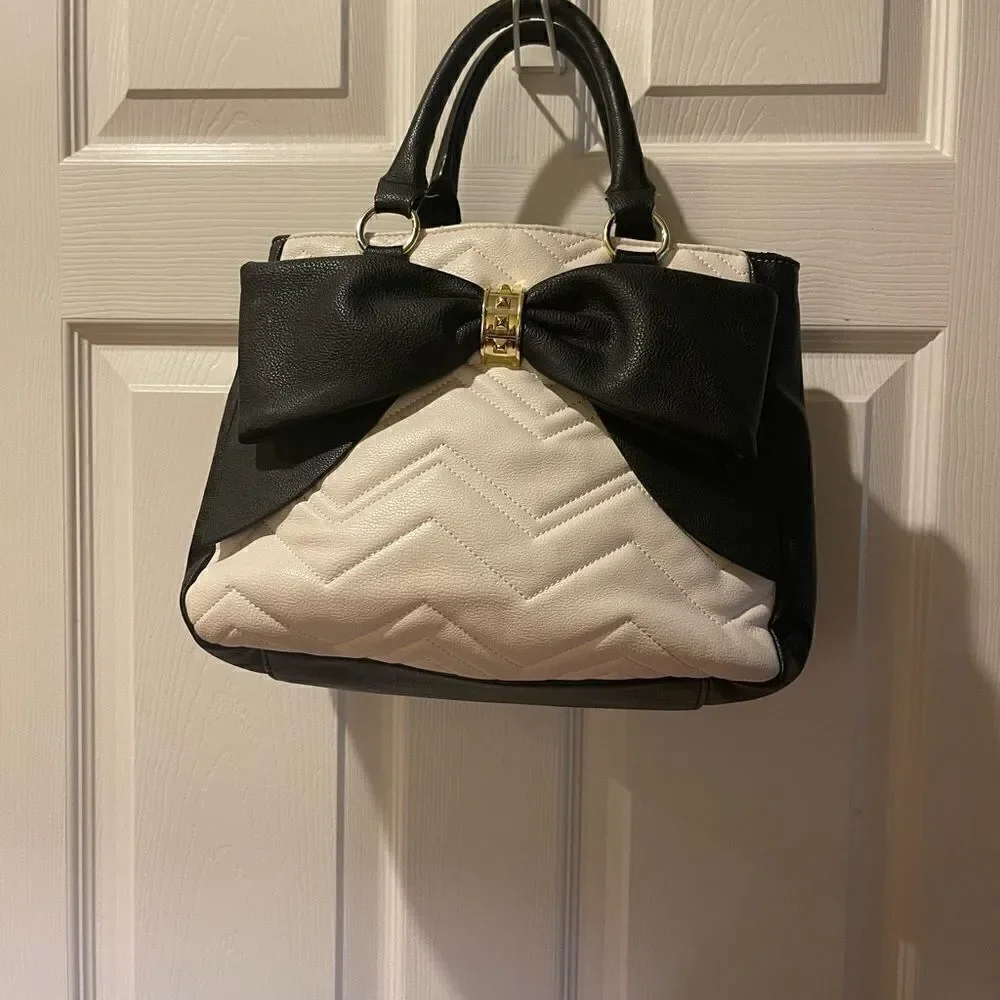 Betsey Johnson off white & Black quilted faux leather satchel with bow accent